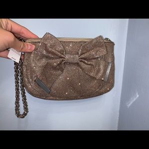 Gold glittery wristlet with front bow